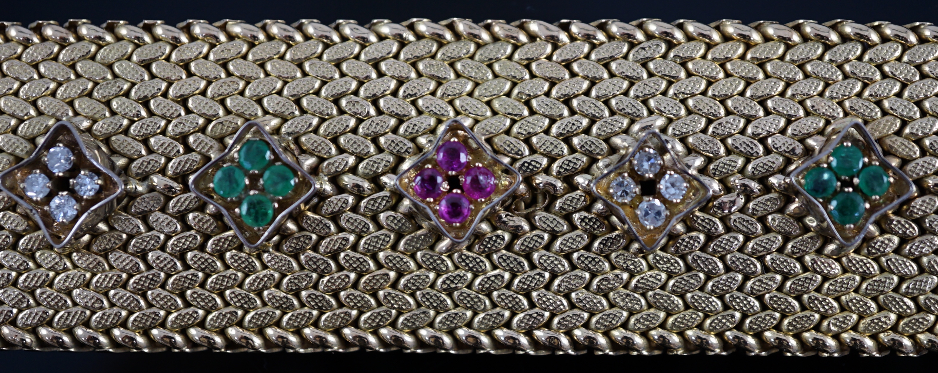 A mid 20th century Italian textured 18ct gold, ruby, emerald and diamond cluster set bracelet